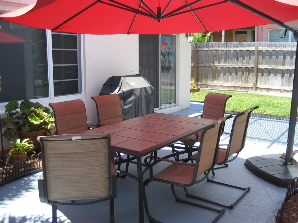 THIS HOME IS ABSOLUTELY BEAUTIFUL AND TRULY IN MOVE-IN-CONDITION. A DOUBLE LOT ON A CORNER WITH 'OVER THE TOP' UPGRADES AND IMPROVEMENTS INSIDE AND OUT. KITCHEN AND BOTH BATHS ARE COMPLETELY REMODELED. NEW CABINETS, GRANITE COUNTER TOPS, S/S APPLIANCES,NEW SINKS AND TOILETS, NEWLY TILED SHOWERS, IMPACT GLASS ALL AROUND (EVEN THE GARAGE), SPRINKLER SYSTEM WITH BACK FLOW PROTECTOR,NEW STEEL SECURITY FRONT DOOR AND FRAME, NEW DOOR LOCKS FRONT AND REAR, ALL NEW RECEPTACLES AND SWITCHES, PROFESSIONALLY LANDSCAPED WITH NEW SOD, $20,000 OF TERRAZZO FLOORS, 6'' CERAMIC BASEBOARDS, NEWLY PAINTED INTERIOR, COURTYARD IS BEAUTIFULLY DESIGNED WITH OVERHEAD AND SECURITY LIGHTS, 6 CAR PARKING PLUS GARAGE AND STREET PARKING.NOTE: 2 CHANDELIERS, WORKBENCH IN THE GARAGE AND OUTSIDE BIRDBATH DO NOT CONVEY.