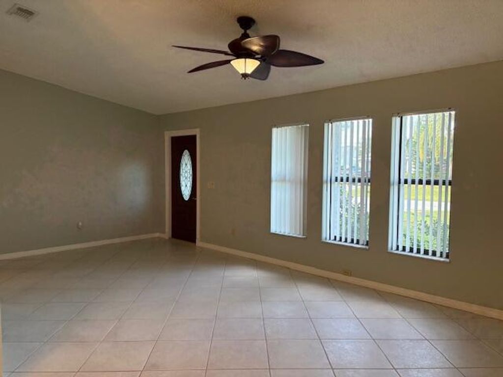 Photo of 400 SW Buxton Avenue, Port Saint Lucie, FL 34983 (MLS # R11139184)