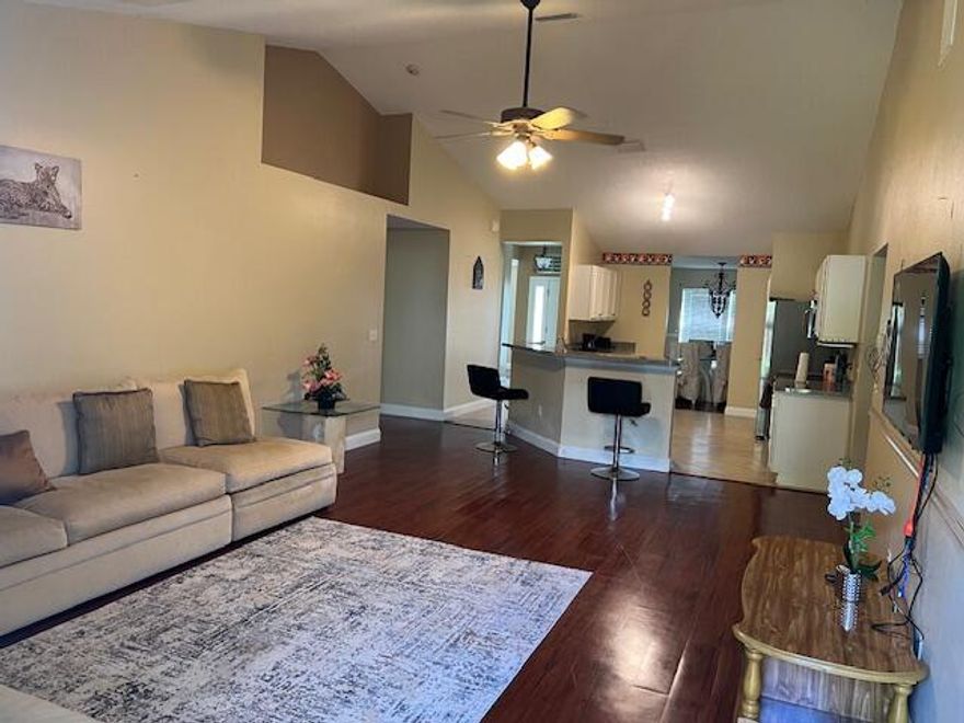 Discover the space and comfort you've been looking for in this 4 bedroom, 3 bath CBS home with a large den that can easily serve as a 5th bedroom or office. Featuring dual living rooms, a formal dining area, and a split floor plan, this home offers flexibility for families, guests, or multigenerational living. The roof was replaced in 2022, and the fully fenced backyard includes fruit trees and plenty of room for outdoor entertaining. Located in a quiet, desirable area of Port St. Lucie with easy access to shopping, schools, and major roadways. Recently price improved and ready for its next owner — schedule your showing today.