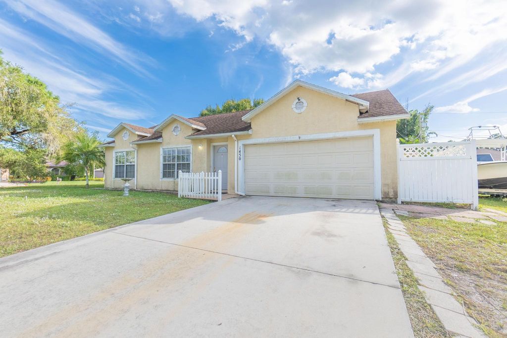 Photo of 1450 SW Gadsan Avenue, Port Saint Lucie, FL 34953 (MLS # R10913453)
