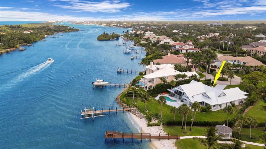 Location! Location! Location! Boaters paradise on crystal clear turquoise water of the Intracoastal.  No fixed bridges - no wake zone with direct access to the Jupiter Inlet & Atlantic Ocean. Renovated 4 bedroom/3.5 bath home with new metal roof & impact glass is located in the coveted gated community of Rolling Hills.  Stunning wide views of the Intracoastal & Jupiter Island from this high elevation lot with over 100 ft of waterfront. Sandy beach & deep water dock with 16k lb lift & additional slip for sizeable yacht. AC bonus room with full bath off garage. Loft w/ gorgeous Intracoastal view. Close to airport, beaches, golf courses, & restaurants.