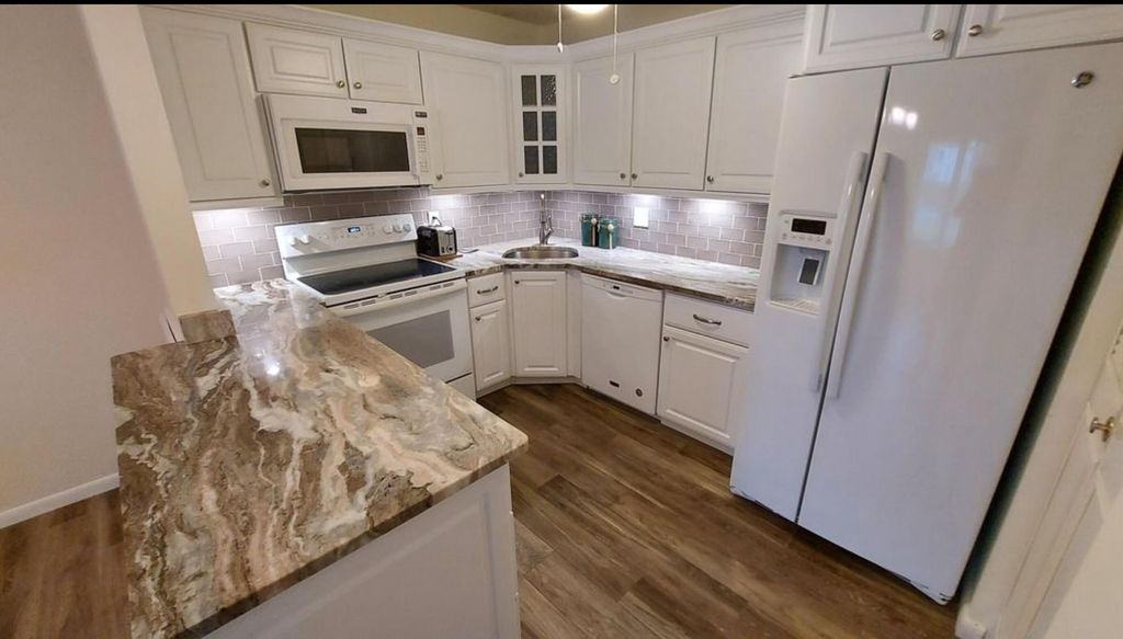 Photo of 234 Pine Hov CIR #D-1, Greenacres, FL 33463 (MLS # B26034577)