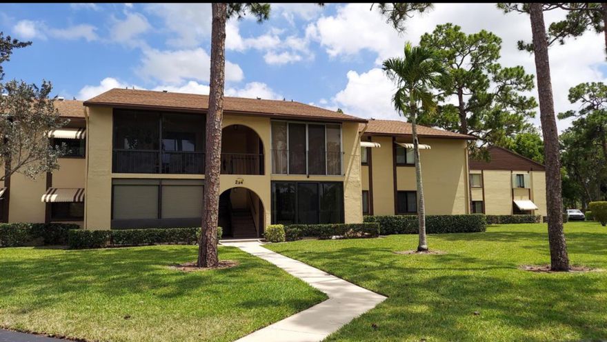 Nicely updated 1st floor home looking over green space, parking in front for easy access, impact windows and doors, nice front porch with impact glass, updated kitchen and bathrooms, in unit full w/d