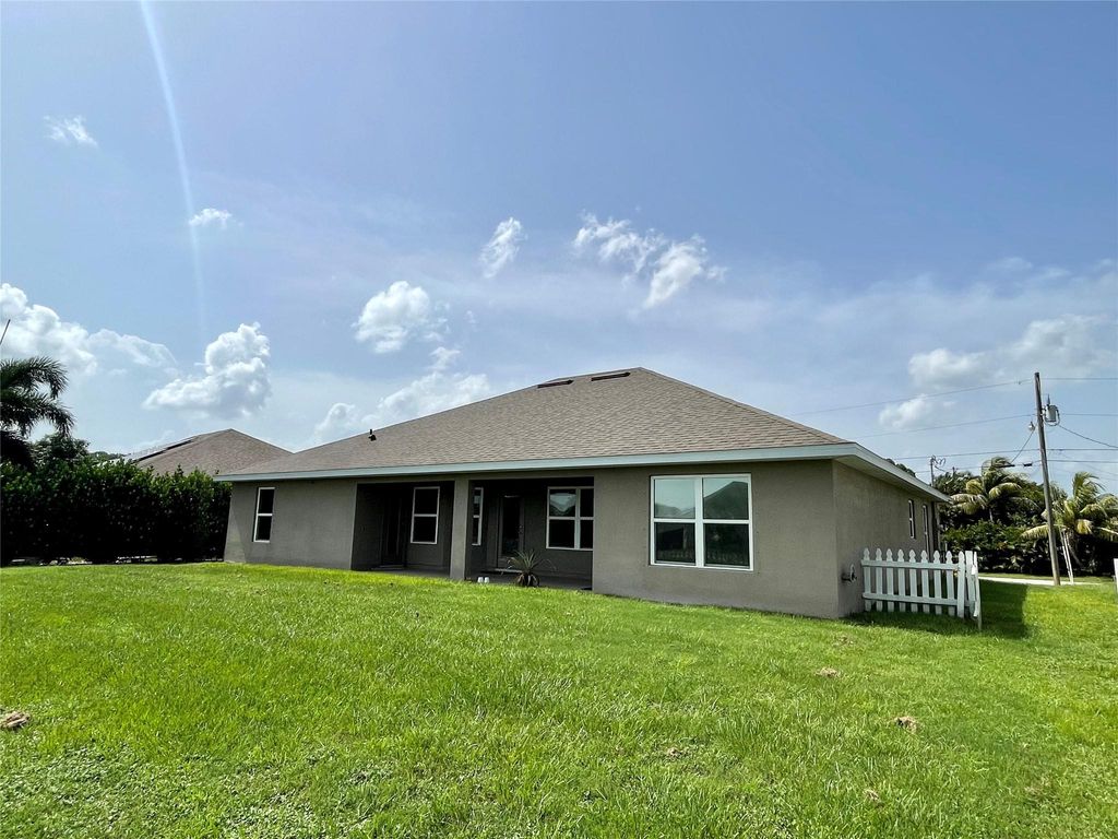 Photo of 4409 SW Gagnon Rd, Port Saint Lucie, FL 34953 (MLS # F10415823)