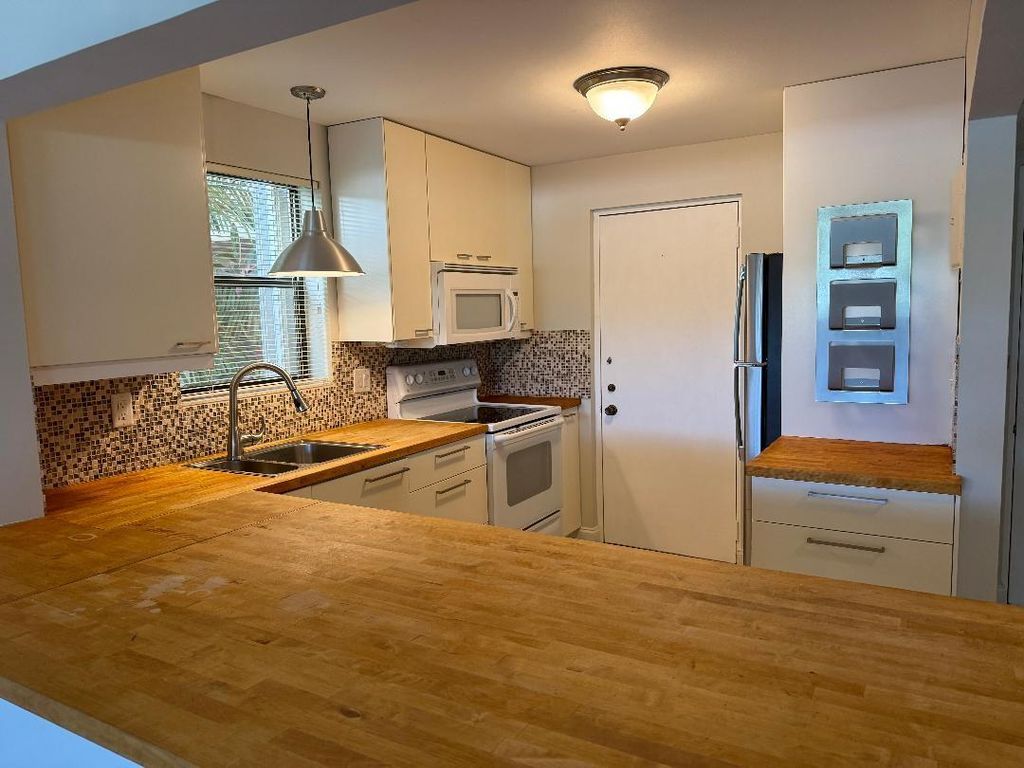 Photo of 2320 S Cypress Bend Drive #104, Pompano Beach, FL 33069 (MLS # F10528991)