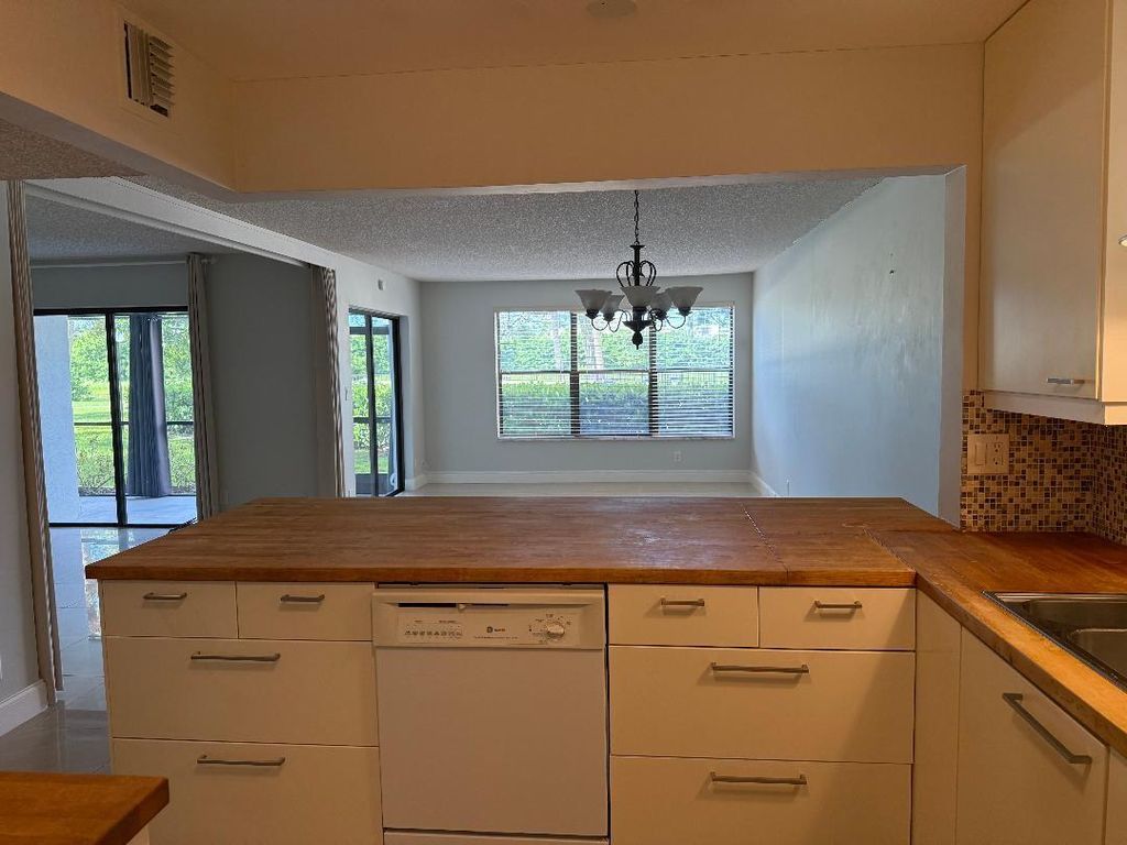 Photo of 2320 S Cypress Bend Drive #104, Pompano Beach, FL 33069 (MLS # F10528991)