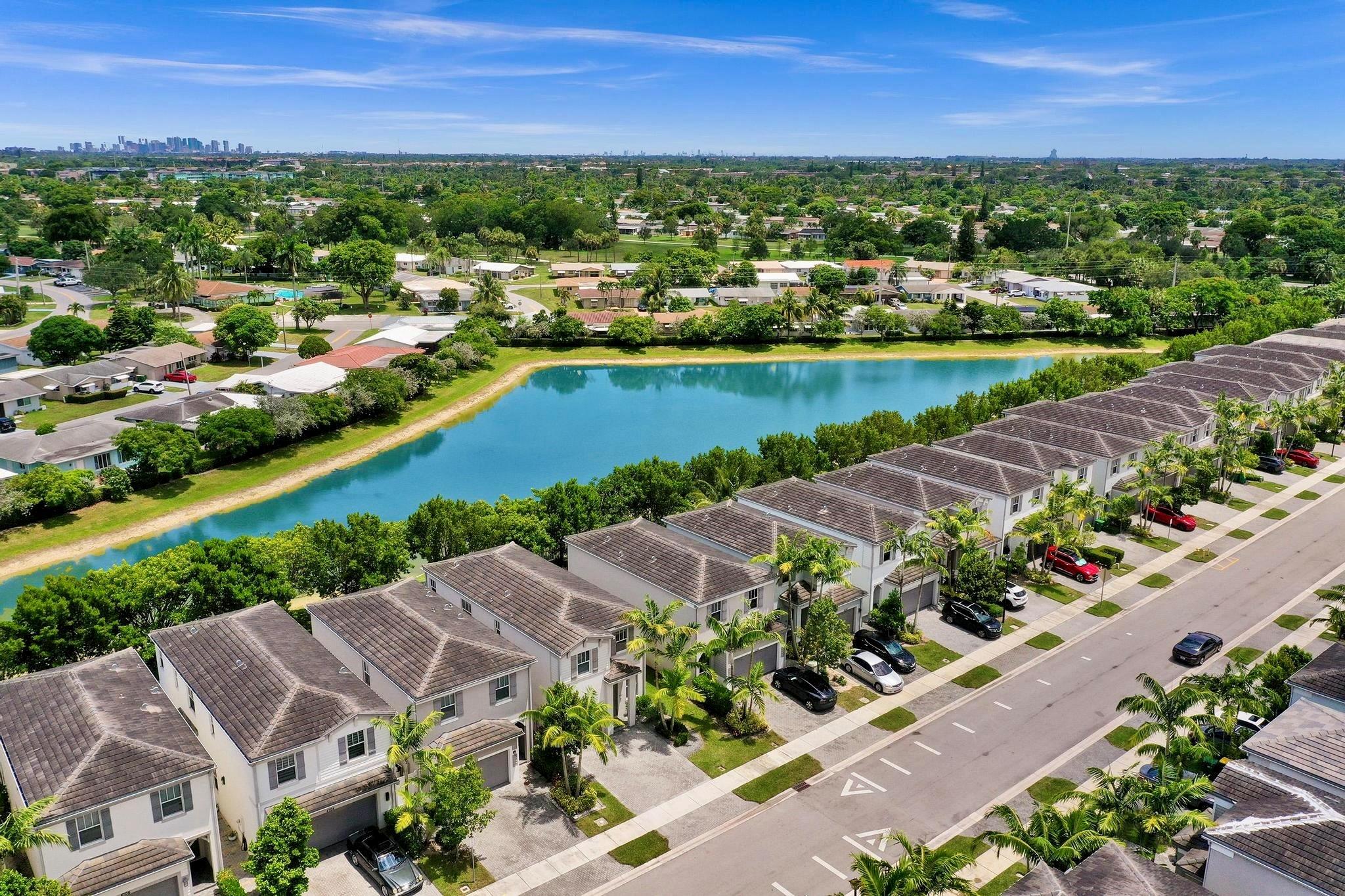 Welcome to your dream lakefront home with 4 bedrooms, 2.5 bathrooms and a 1 car garage in Hidden Trails! Built in 2018, this beautifully maintained property features a bright and open floor plan, impact windows, quartz countertops, gray cabinetry, tile floors downstairs, and wood plank vinyl floors upstairs. The fully fenced quiet backyard showcases stunning lake views—ideal for relaxing or entertaining. In addition, Mainlands Park is across from the development with walking paths, outdoor exercise equipment, and fishing, along with some beautiful nature views! With a low HOA fee of just $155/quarter, a community pool, and quick access to the Turnpike, this home truly checks all the boxes!!