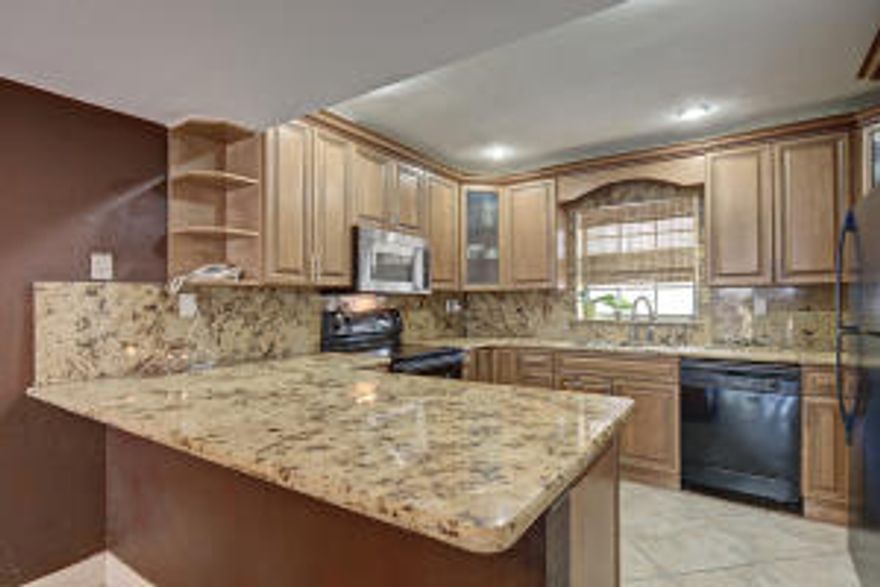 Gorgeous 2 bed 2.5 bath townhouse close to (595, the turnpike, I-95, the beaches, Sawgrass outlet mall and BB&T center for concerts/sporting events. Chateaulaine is a peaceful and quite community with tennis courts, a pool and clubhouse.  This is a lush landscaped community where the landscaping is currently being trimmed & updated. Kitchen and bathrooms updated, tile throughout main floor and the highest-end laminate wood flooring on 2nd floor. Unit is large and has oversized master bedroom with in-suite bath, shower & Jacuzzi tub. Master bedroom has suite balcony & oversized closets. Second bedroom is the size of many master bedrooms with bath and walk-in closets. Storage under stairs. Huge fenced back yard area perfect for stargazing & relaxing.