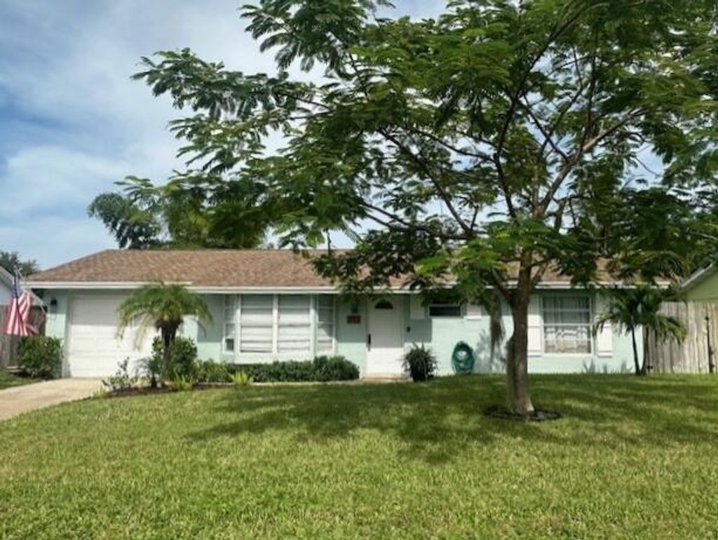 Photo of 8713 SE Sandridge Avenue, Hobe Sound, FL 33455 (MLS # R11129592)