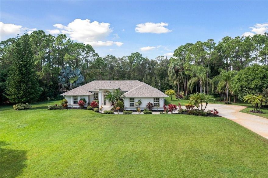 Welcome to your completely refreshed custom retreat in Vero Lake Estates!  Sitting on 1.12 sprawling acres, this 3-bedroom, 2-full bathroom/2-half bathroom custom-built home offers 2,340 sq ft of refined living. Experience true peace of mind with a brand-new roof and fresh paint (interior and exterior) in 2025.  The outdoor oasis features a private, screened-in pool and lanai, freshly resurfaced in 2019, perfect for year-round enjoyment. Inside, find modern convenience with stainless steel appliances and a unique bedroom suite with a separate, private entrance—ideal for a home business, office, or client meetings. The living room opens to an additional screened porch area, affectionately dubbed "heaven" by the current owner. Well-maintained and move-in ready!Additional parking for RV/boat.
