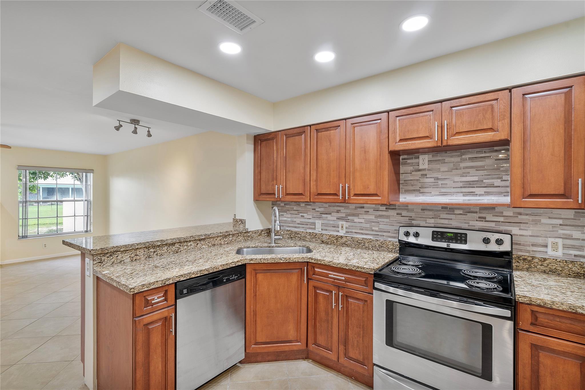 Bright and spacious remodeled townhome with 2-car garage and stunning canal views! The living room boasts soaring ceilings, recessed lighting, and abundant natural light from multiple windows and sliders. New vinyl wood flooring (5/2025), freshly painted interior (4/2025), and popcorn ceilings removed. Inviting granite kitchen with stainless steel appliances, remodeled in 2020. Upstairs bathrooms redone (5/2025). Grand primary suite with jacuzzi tub and walk-in closet. Enjoy the screened porch plus a separate patio—perfect for entertaining or stargazing. Washer/dryer (1/2025). Pet friendly (under 25 lbs). Association covers community pool, roof repairs, insurance, water & more—plus reserves! Conveniently located near top rated elementary & high schools. Prime location near the expressway.