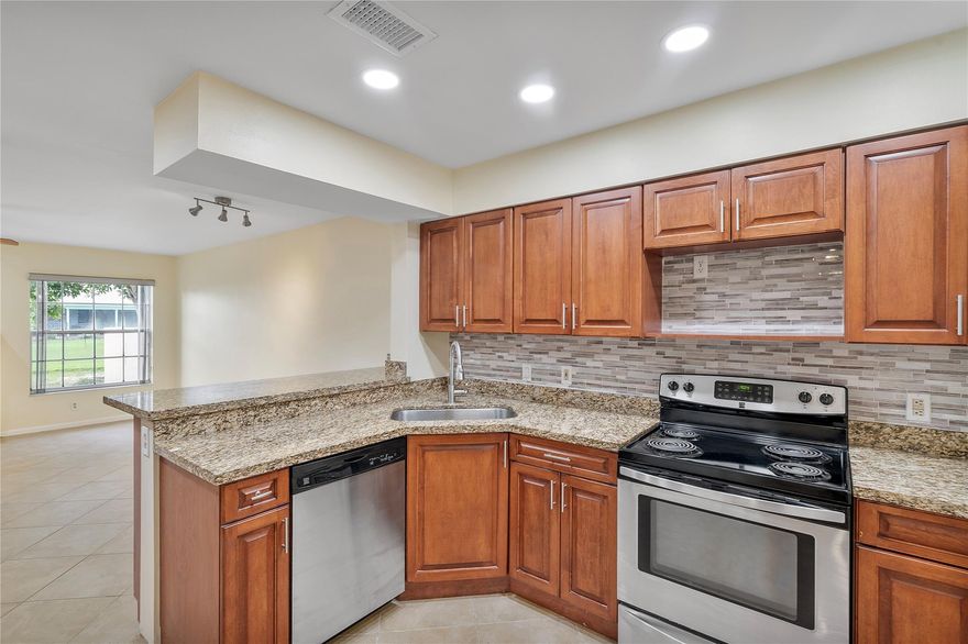 Bright and spacious remodeled townhome with 2-car garage and stunning canal views! The living room boasts soaring ceilings, recessed lighting, and abundant natural light from multiple windows and sliders. New vinyl wood flooring (5/2025), freshly painted interior (4/2025), and popcorn ceilings removed. Inviting granite kitchen with stainless steel appliances, remodeled in 2020. Upstairs bathrooms redone (5/2025). Grand primary suite with jacuzzi tub and walk-in closet. Enjoy the screened porch plus a separate patio—perfect for entertaining or stargazing. Washer/dryer (1/2025). Pet friendly (under 25 lbs). Association covers community pool, roof repairs, insurance, water & more—plus reserves! Conveniently located near top rated elementary & high schools. Prime location near the expressway.