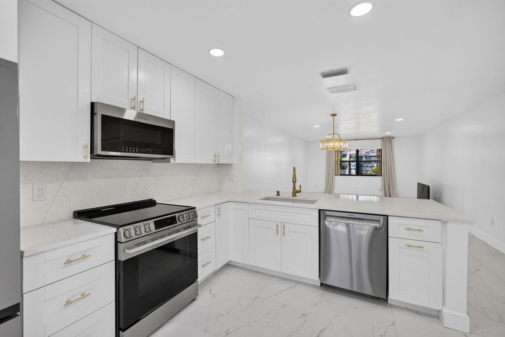 Photo of 320 Elmira Court, Royal Palm Beach, FL 33411 (MLS # B26063524)