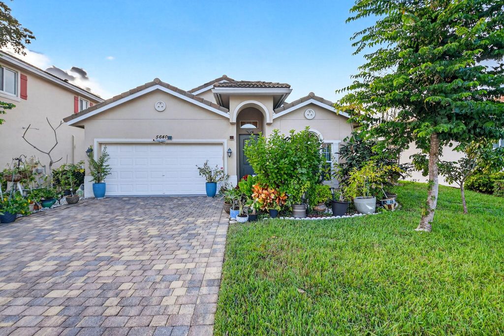 Photo of 5640 Caranday Palm Drive, Greenacres, FL 33463 (MLS # R11151866)