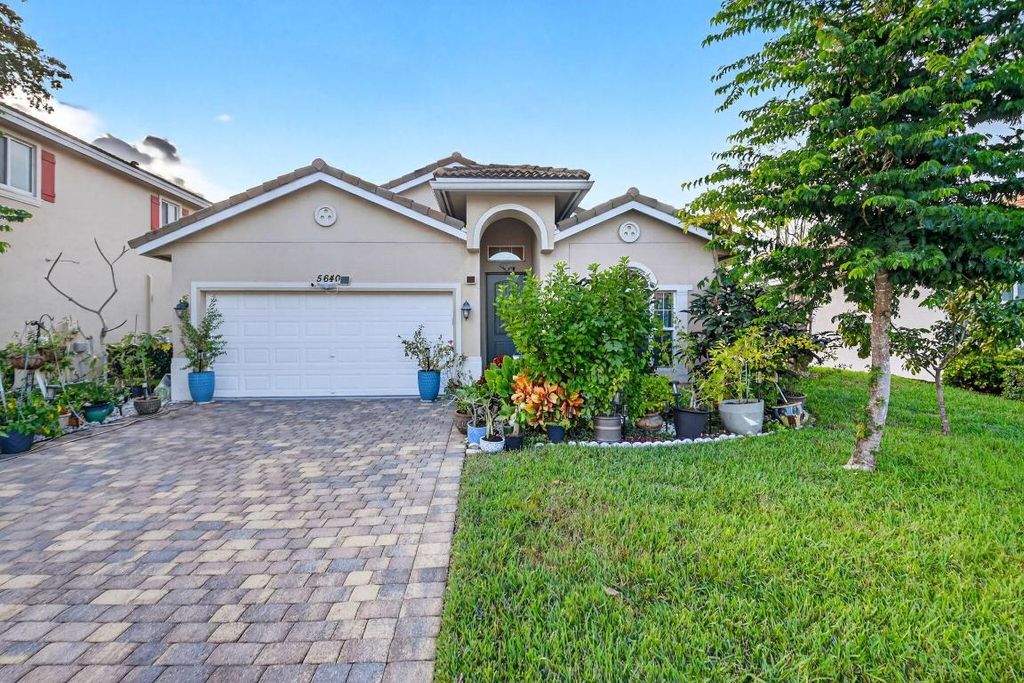Photo of 5640 Caranday Palm Drive, Greenacres, FL 33463 (MLS # R11151866)