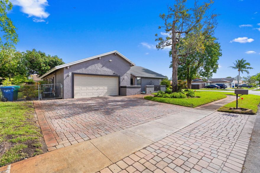 Beautiful and well-maintained 3-bedroom, 2-bath single-family home offering approximately 1,700 sq ft of comfortable living space! This home features a spacious open-concept layout with a bright and airy living area, large tile flooring throughout, and an updated kitchen with modern cabinetry, stainless steel appliances, and a stylish backsplash.  The split floor plan provides privacy, while the generous living and dining areas are perfect for entertaining. Natural light pours in through sliding glass doors, creating a warm and inviting atmosphere.  Situated on a nicely maintained corner lot with mature landscaping, a fenced yard, and great curb appeal. Conveniently located near schools, parks, shopping, and major roadways.  Move-in ready and in great condition — perfect for homeowners  looking for space, comfort, and style!