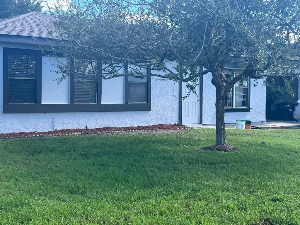 Photo of 1401 SE Belcrest Street, Port Saint Lucie, FL 34952 (MLS # R11154030)