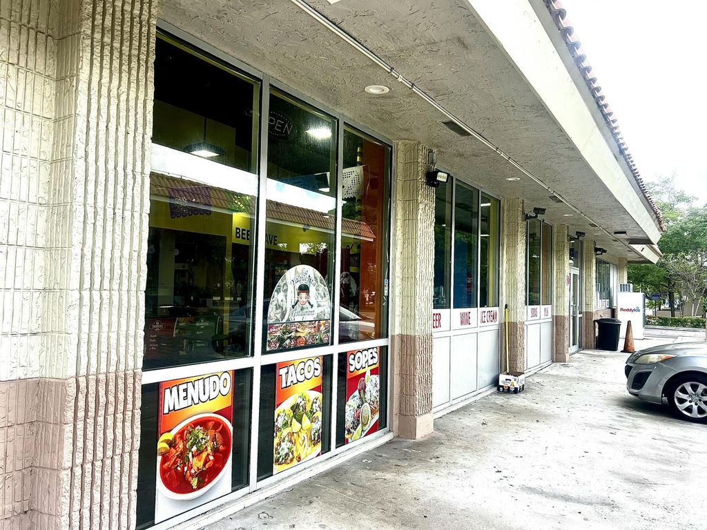 Photo of 7380 Wiles Road, Coral Springs, FL 33067 (MLS # B26013978)