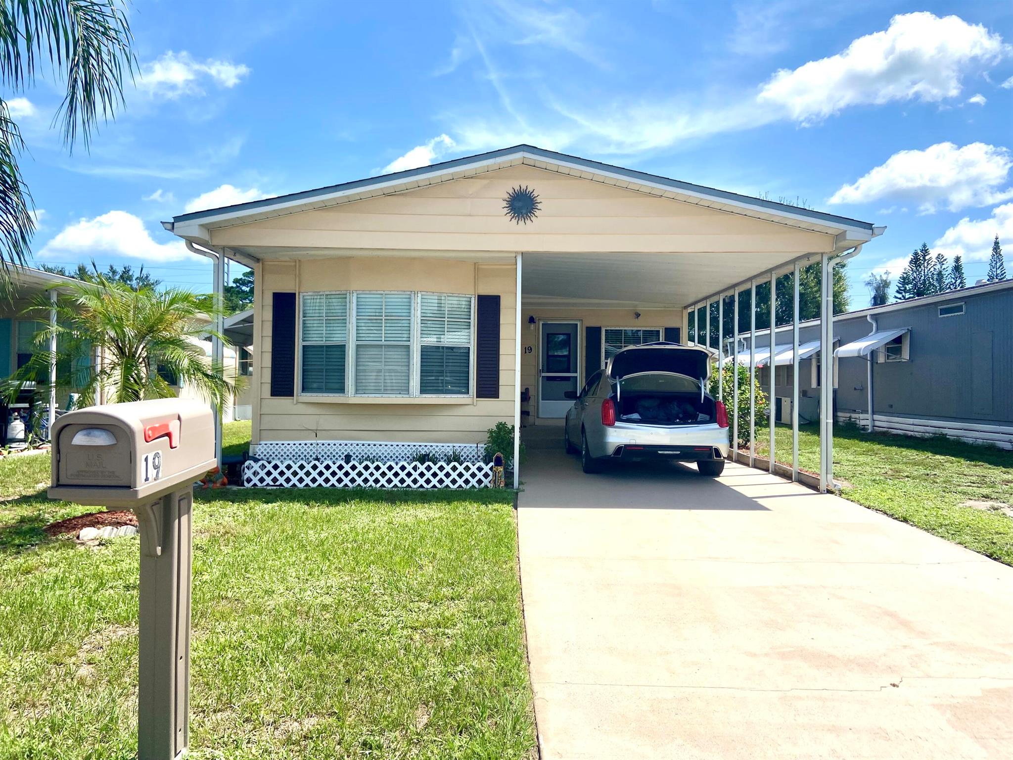 TURN KEY and move in clean!Fantastic find in this 2 bed 2 bath home fully furnished as shown with all essentials and 2 kitchens for the happy cooks to enjoy. New AC and many updates to make this a comfortable home for you and your guests!! Laminate floors throughout for easy maintenance giving more time for all the fun activities in this great 55+ community. Land lease includes trash and recycles, lawn mowing and free 9 hole golf course, pool, tennis, pickle ball, yoga and more. Close to BEACHES, shopping and lots to do favorites in Sunny Florida. Open houses are coming, and you may call me directly to schedule a private showing. All buyers must get residency approval from Spanish Lakes communities to become a proud homeowner here! Don't hesitate on this one! LET THE FUN BEGIN! Call TODAY