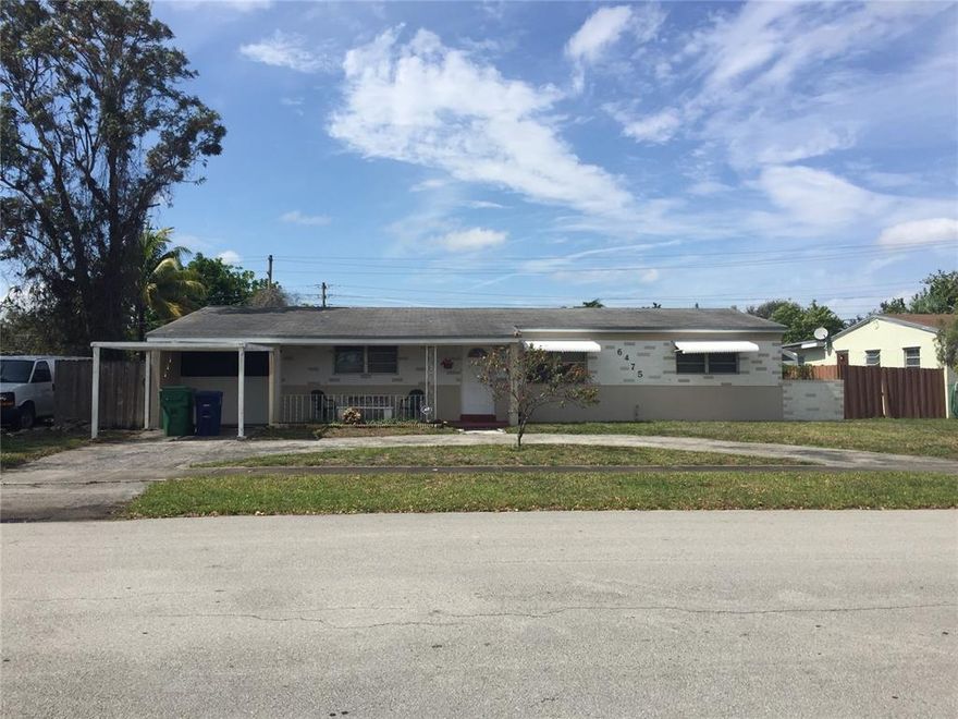 Spacious move in Miramar beauty! Great location! One story single family home with circular driveway and a carport! Huge fenced in property.  Living, Dining plus family room! Screened in patio on the back.  Utility room with washer and dryer.  Open Kitchen.