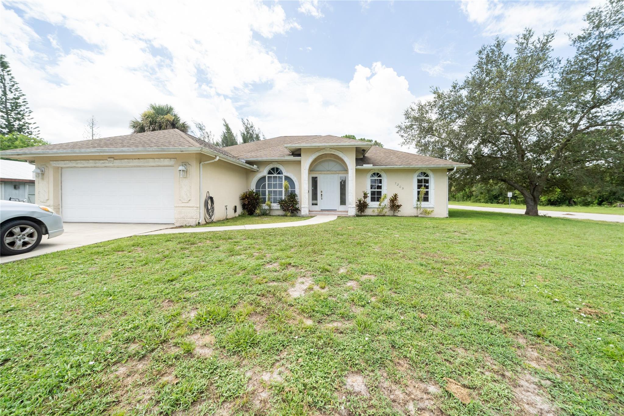 This home offers practical elegance and ample space in a peaceful, family-friendly setting. With thoughtful design, comfortable amenities, and a quiet corner-lot location, it’s ready to become your next cozy home or smart investment. . Perfect for a large family and/or work-from-home space; the split floor plan features 3 bedrooms with a massive bonus room ideal for a 4th bedroom conversion, at-home office, or entertainment area! Master bedroom features large walk-in closet with dual sinks, soaking tub, and separate stand-in shower in the master bath featuring private access to screened patio! Kitchen features a breakfast bar, huge pantry, and 3 panel slider passthrough window to screened patio perfect for family/friend get-togethers!