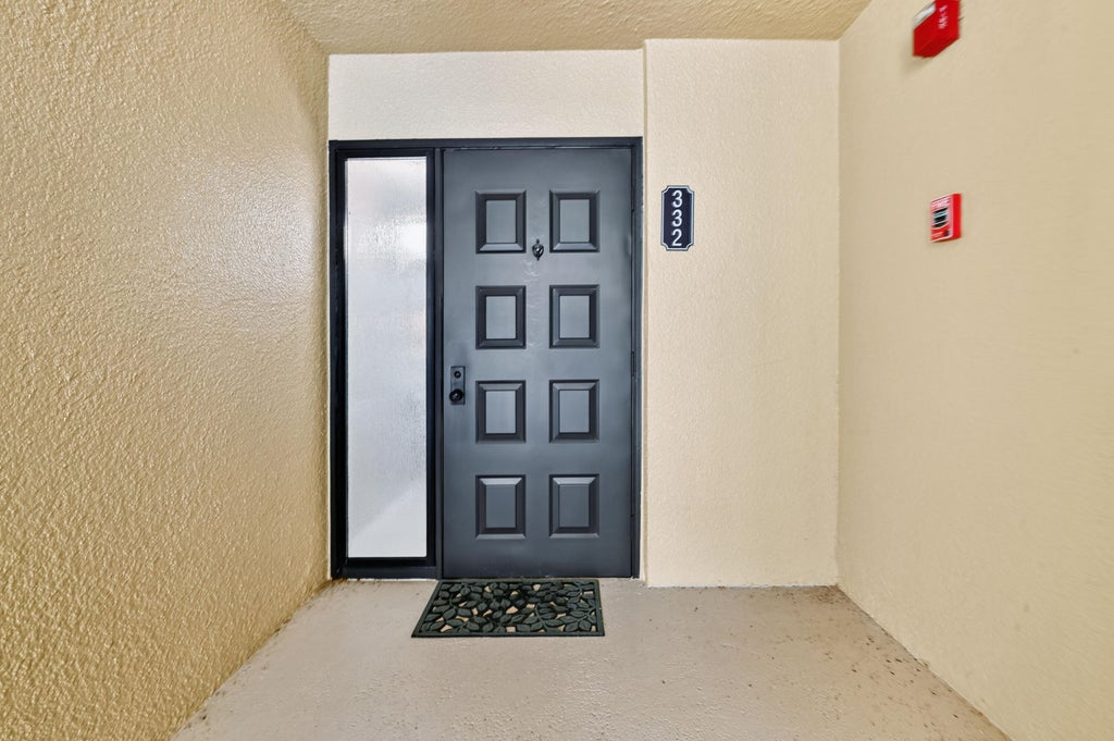 Photo of 5188 Woodland Lakes Drive #332, Palm Beach Gardens, FL 33418 (MLS # B26042471)