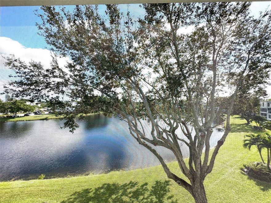 RENOVATED 1 bedrm, 1.5 bath condo on the 4th flr w/a BEAUTIFUL VIEW OF THE LAKE! This unit features an open kit w/granite cntrs, tile backsplash, recessed ltg, ext cab & white appl. Interior upgrades incl tile on the diagonal, updated primary bathroom w/shower stall & half bath w/modern finishes. The condo comes fully furnished, has a BRAND NEW A/C, newer water heater & new electrical panel. Enjoy the serene lake view from the screened patio, complete w/accordion shutters & storage cabs. This active adult gated comm offers 24 hr sec, free busses & a fantastic array of amenities incl pools, tennis, pickle ball, Clubhouse w/billiards, movies, shows, classes, clubs & more! ASSOC CLAIMS 55+ Prime location—walk to the clubhouse and pool, and just minutes from the main gate for easy access.