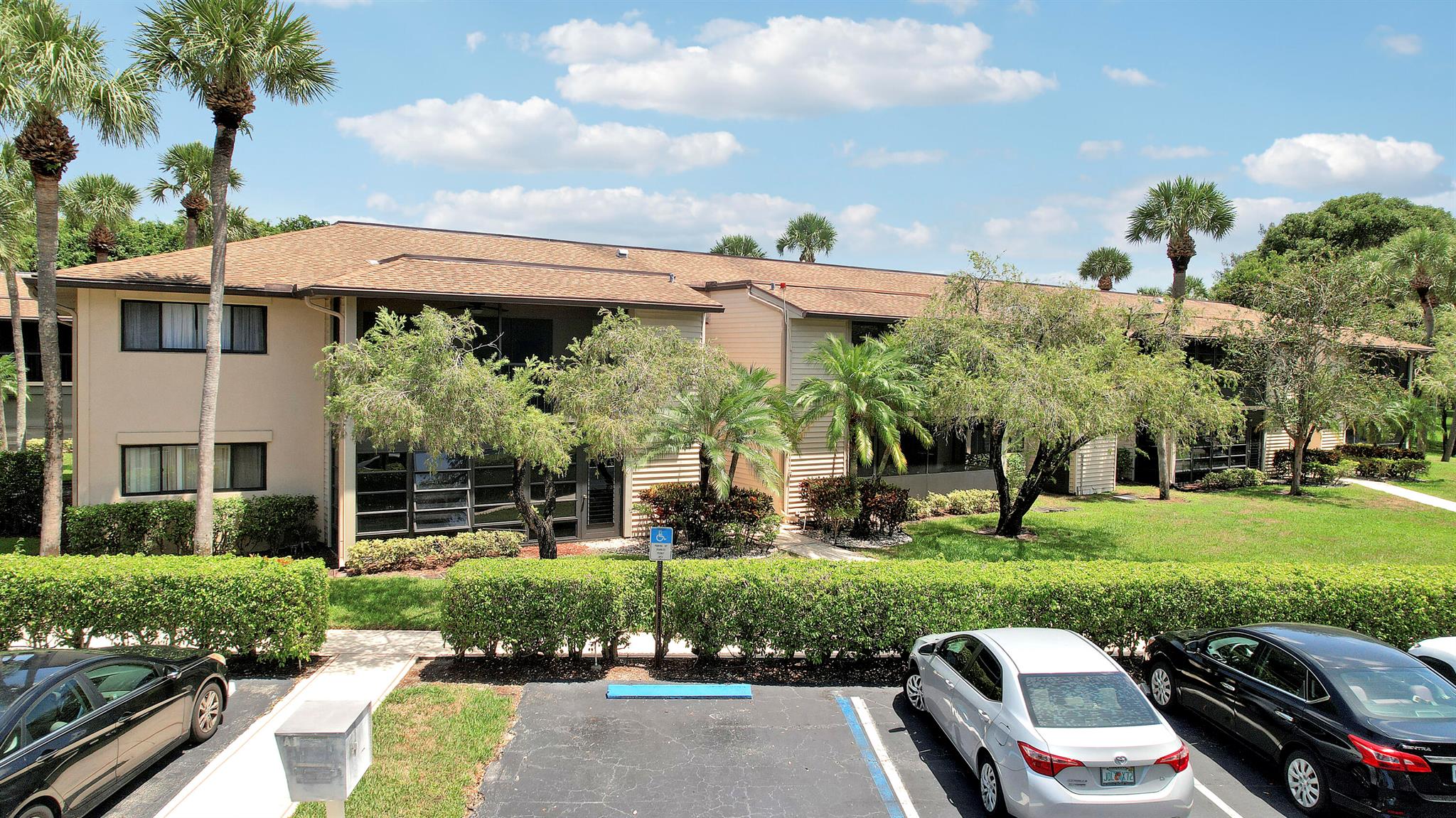 Welcome home to this beautifully renovated & tastefully furnished 2 bedroom, 2 bathroom 1st floor condo in the desirable 55+ gated community of Lakes of Delray. Cable & Internet included. Located in Witney A, this residence is just steps to the newly renovated clubhouse with an Olympic-sized pool, fitness center, and endless activities. Enjoy a spacious open kitchen with stone counters, stainless steel appliances, and full-size washer/dryer. Relax on the large screened lanai with peaceful views, perfect for morning coffee. Both bedrooms are generously sized and tastefully furnished with queen beds; the primary suite includes a large walk-in closet. With modern finishes, comfort, and a prime location, this rental is ideal if you're relocating or in need of a beautiful place in between hom