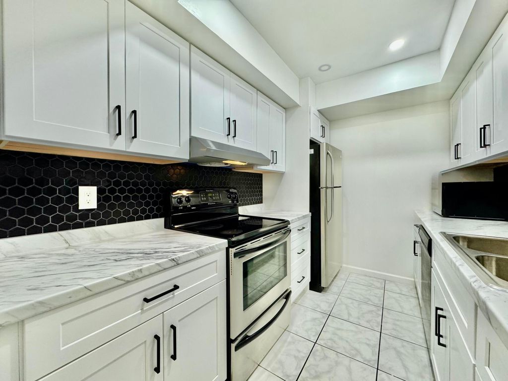 Photo of 3910 Crystal Lake Drive #301, Deerfield Beach, FL 33064 (MLS # R11064642)