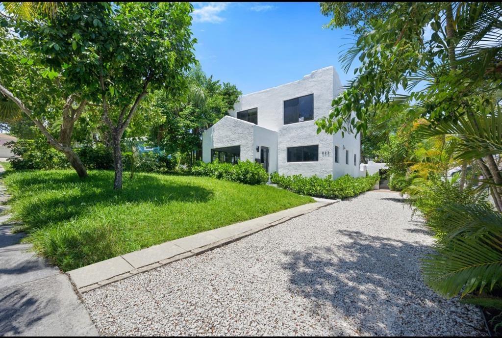 Incredible historic 1926 home in the Northwood neighborhood, totally remodeled, with magnificent finishes. This property has in the main house 3 bed 3 1/2 bath plus bungalow in the back with full bath and kitchenette. The bedroom on the main level can be used as a office or daily breakfast room. The half guest bathroom has high end finishes. Brand new impact doors and windows. The second floor has 2 bedrooms, the master with incredible closets, totally custom made, with Swedish materials. master bath with custom vanity, the second bedroom has a full bathroom with bathtub. The kitchen is fully illuminated with 3 large windows, and was customized with high quality materials, the counter top and backsplash is made with Italian Quarzo. New high-quality Stainless Steel Appliances.