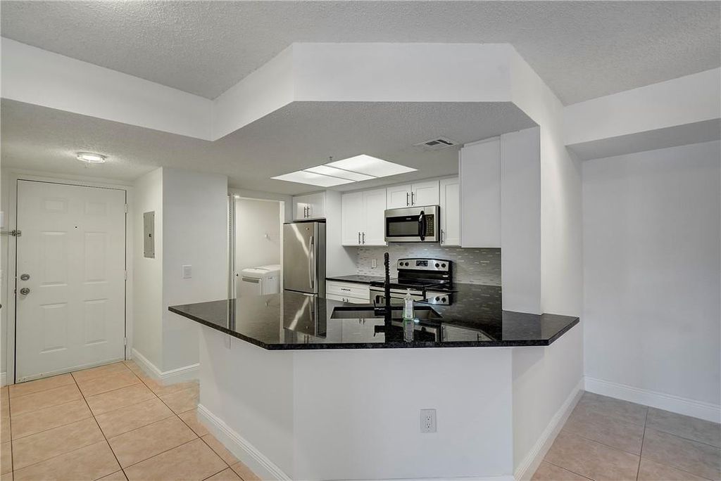 Photo of 5025 Wiles Road #207, Coconut Creek, FL 33073 (MLS # F10421370)