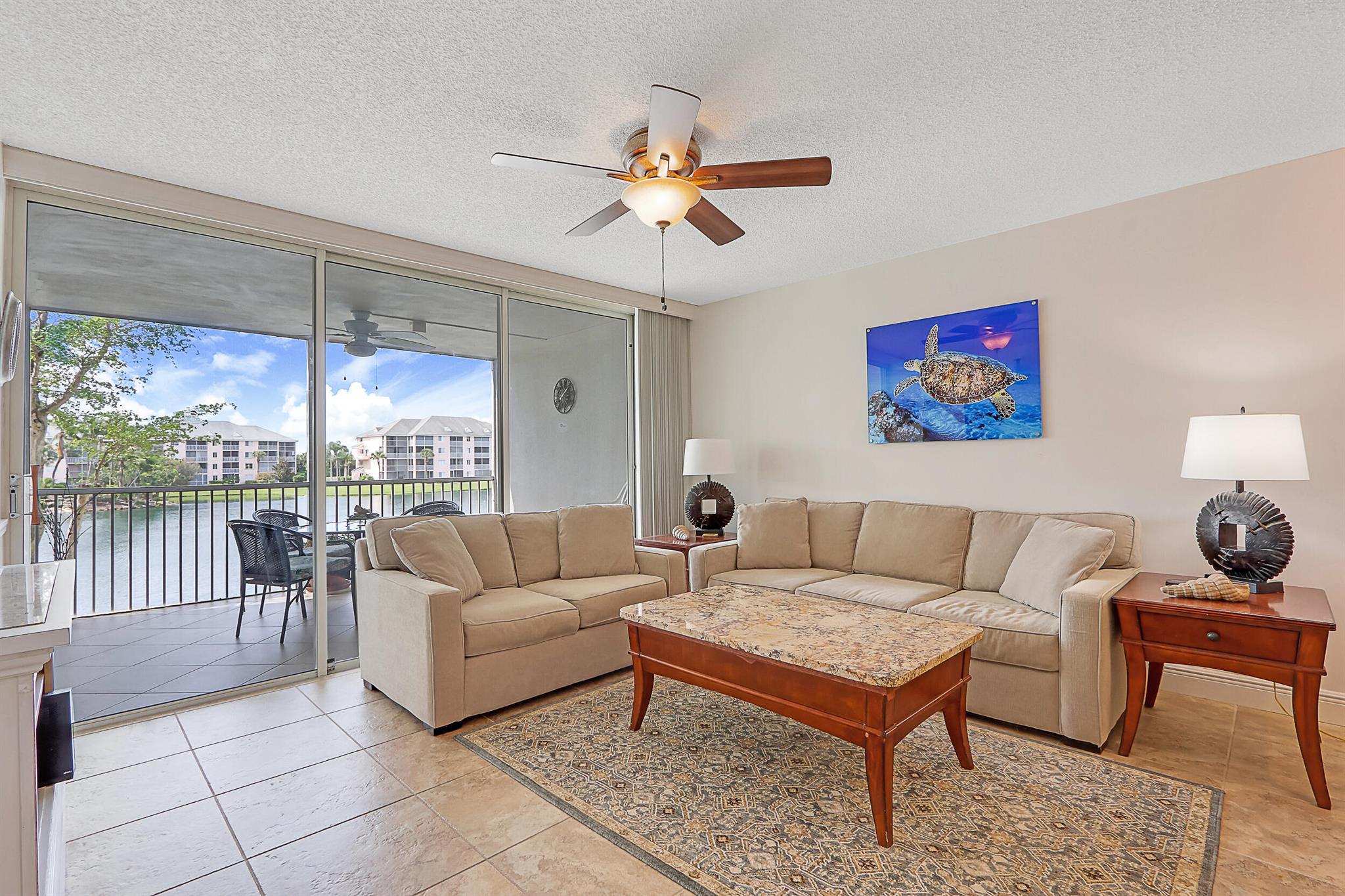 Beautiful 2/2 condo on second floor (elevator) with beautiful lake views, lovely/comfortable decor, tile floors throughout, open newer kitchen w/ Quartz countertops and new cabinets, stainless steel appliances, washer/dryer, new hall bath, great location which is close to pool and right next door to the restaurant in community, walk to shops in Harbourside and beach, king size bed in master bedroom and two beds in guest room. All utilities included in rent with cap of $50 electric monthly. No HOA approval to deal with. Move in as quick as a few days. Available July 30, 2025 for off season months ($2,200) and seasonal months ($6,800).