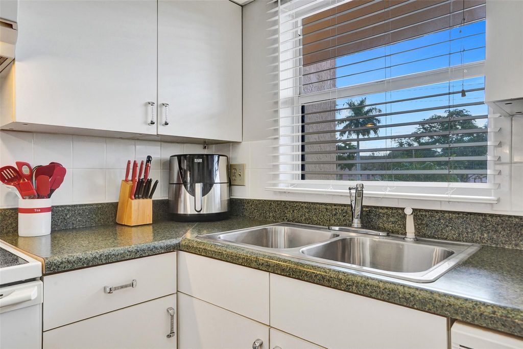 Photo of 10467 Sunrise Lakes Blvd #210, Sunrise, FL 33322 (MLS # F10539994)