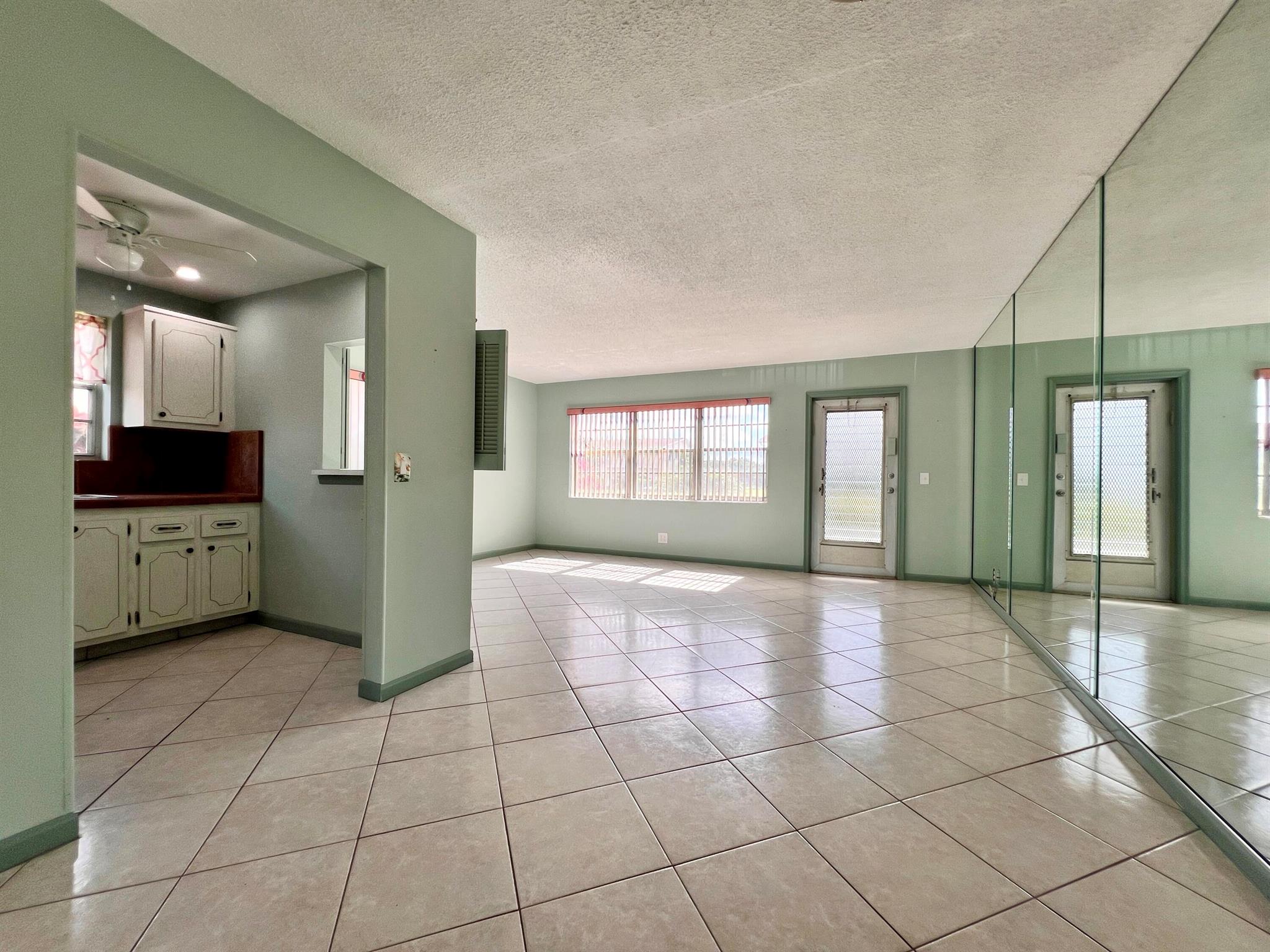 Light, Bright, and Move-In Ready In 55+ Century Village! Lovely and Well Priced FIRST FLOOR CORNER 1/1.5 With Central AC, Updates, and Fantastic Location. Neutral Tile Flooring Throughout. Nicely Updated Baths. Kitchen Features White Appliances, Tile Flooring, High-Hat Lights, and Window Over Sink for Natural Light. Spacious Bedroom Suite with Access to the Enclosed Lanai, Wall of Closets, and Updated Full Ensuite Bath. Fantastic Location Close to the Somerset Pool, Walking Path, and the Main Clubhouse. Well Maintained Building With New Roof! Century Village Is A Resort Style 55+ Community With So Much To Offer...