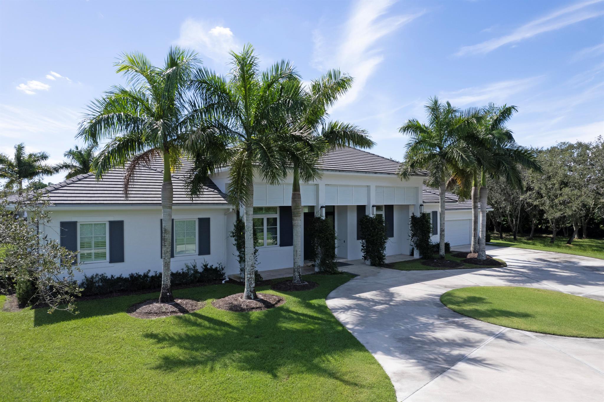 Exclusive Beauty & Extremely Private in the Gated Equestrian Community of Palm Beach Point. MOVE-IN READY!! 4 Bedrooms, 5 1/2 Baths, Impact Glass, & Sauna. 12 Stall oversized Center Aisle Barn with plenty of wash racks, owners lounge, Beautiful OVERSIZED AC Tack Room, Apartment on Barn, Separate Laundry & Bath in Barn, State of the art Arena with Mirrors, Paddocks, Round Pen & Separate Gated Barn Entrance.....plenty of room for trailers. Property is situated Perfectly!!! Call for Appointment.