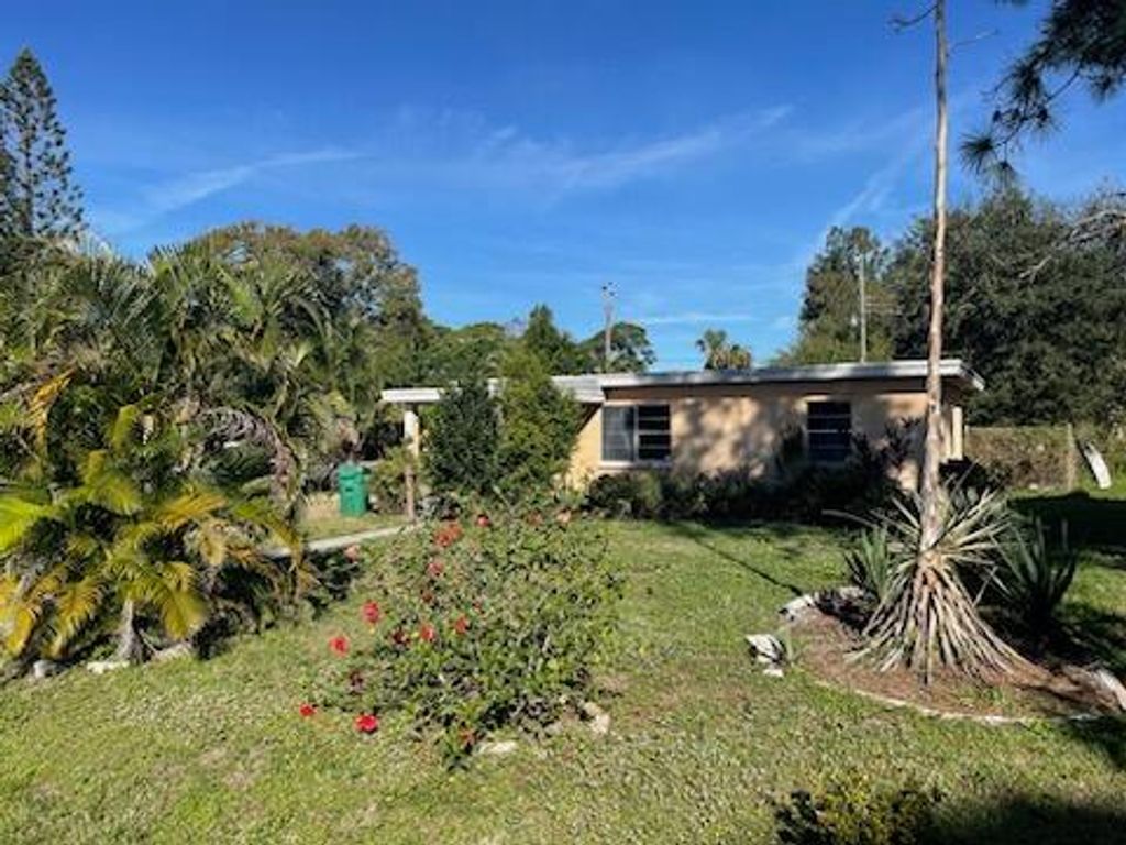 Photo of 3504 W Lake Drive, Fort Pierce, FL 34982 (MLS # R10941212)