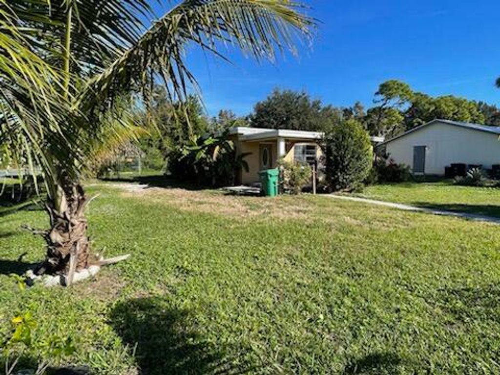 Photo of 3504 W Lake Drive, Fort Pierce, FL 34982 (MLS # R10941212)