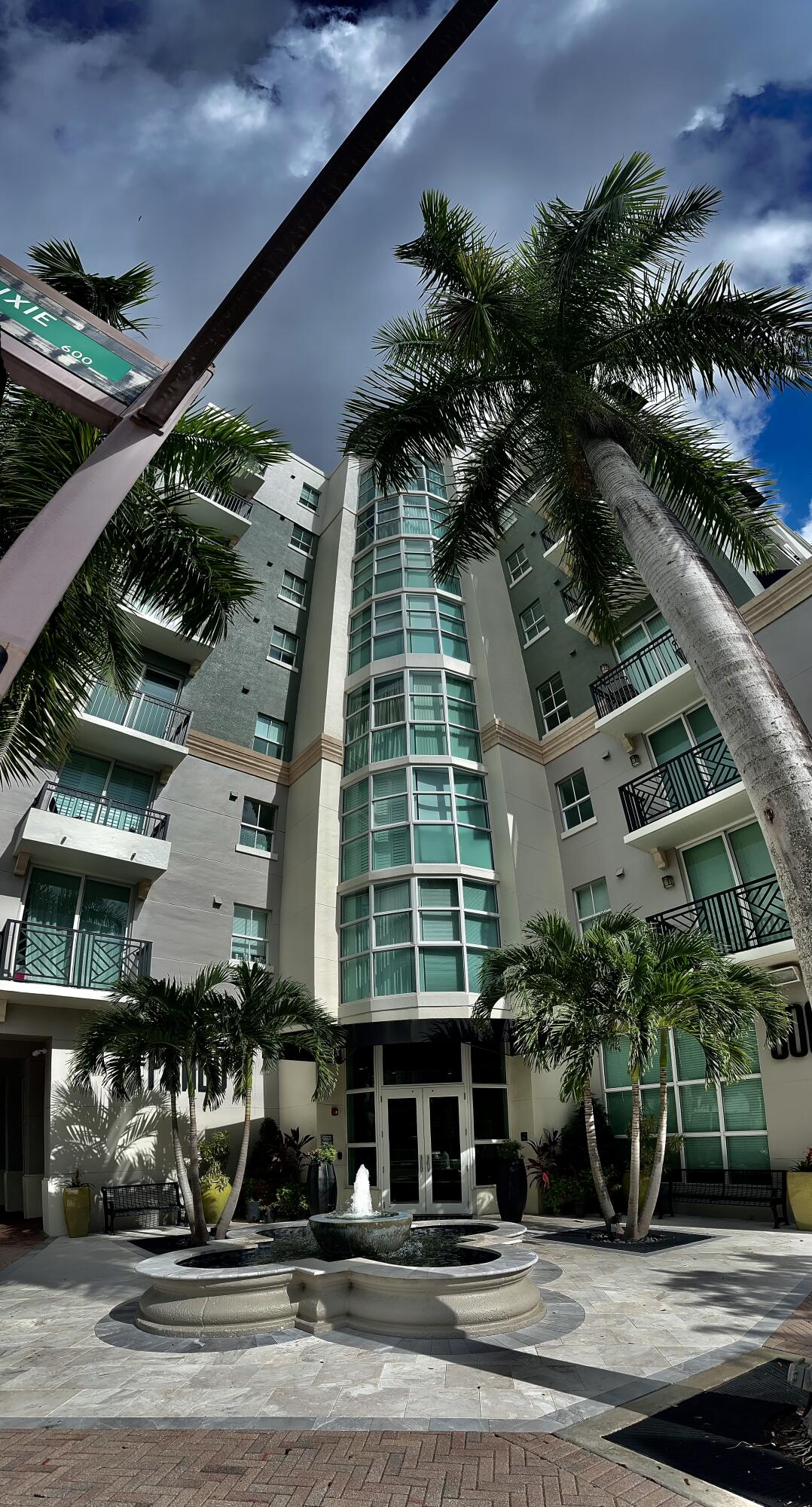 Ideally located in the Heart of Downtown West Palm Beach, this modern 1-bedroom, one bathroom condo offers a spacious and stylish living space in the sought-after Prado community. The open kitchen features stainless steel appliances, wood cabinetry, and polished black granite countertops, perfect for entertaining. Wood floors adorn the master bedroom, living room, and den/dining area, creating a warm and inviting atmosphere. The unit includes custom window treatments and a small private balcony. Enjoy all the amenities Prado has to offer, including a 24-hour attended lobby, luxury pool, clubhouse, beautifully landscaped garden area, and a well-equipped workout facility. Ideally situated just one block west of Flagler Drive and the Intracoastal Waterway, with a short walk to CityPlace,