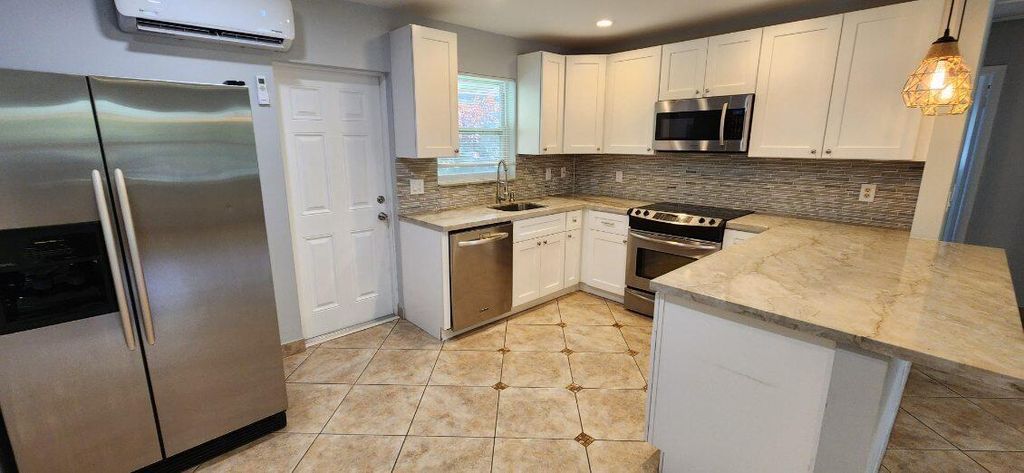 Photo of 1752 Seder Lane, North Palm Beach, FL 33408 (MLS # R11121408)