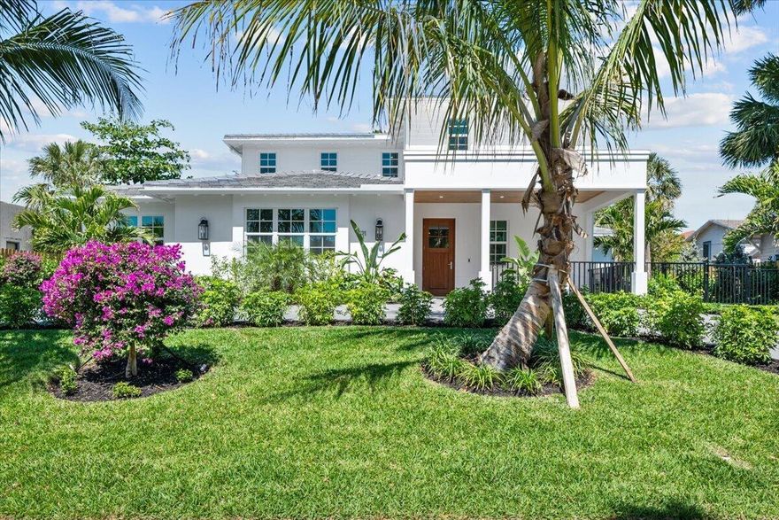 Nestled in the heart of the historic Flamingo Park neighborhood, 721 Kanuga Drive is a masterpiece of modern elegance and classic Palm Beach charm. Designed and built by Sam Fisch Development, this newly constructed estate sits on a rare double lot at the City's highest elevation. Spanning nearly 5,000 sq. ft., the open-concept layout offers 5 bedrooms, 4.5 baths, and expansive living spaces. The primary suite boasts a spa-inspired bath and his-and-hers closets. Lush landscaping frames an outdoor oasis with a summer kitchen, perfect for entertaining. A detached two-car garage adds convenience, while the location places you minutes from City Place, The Norton Museum, pristine beaches, and within the highly sought-after Palm Beach public school district.