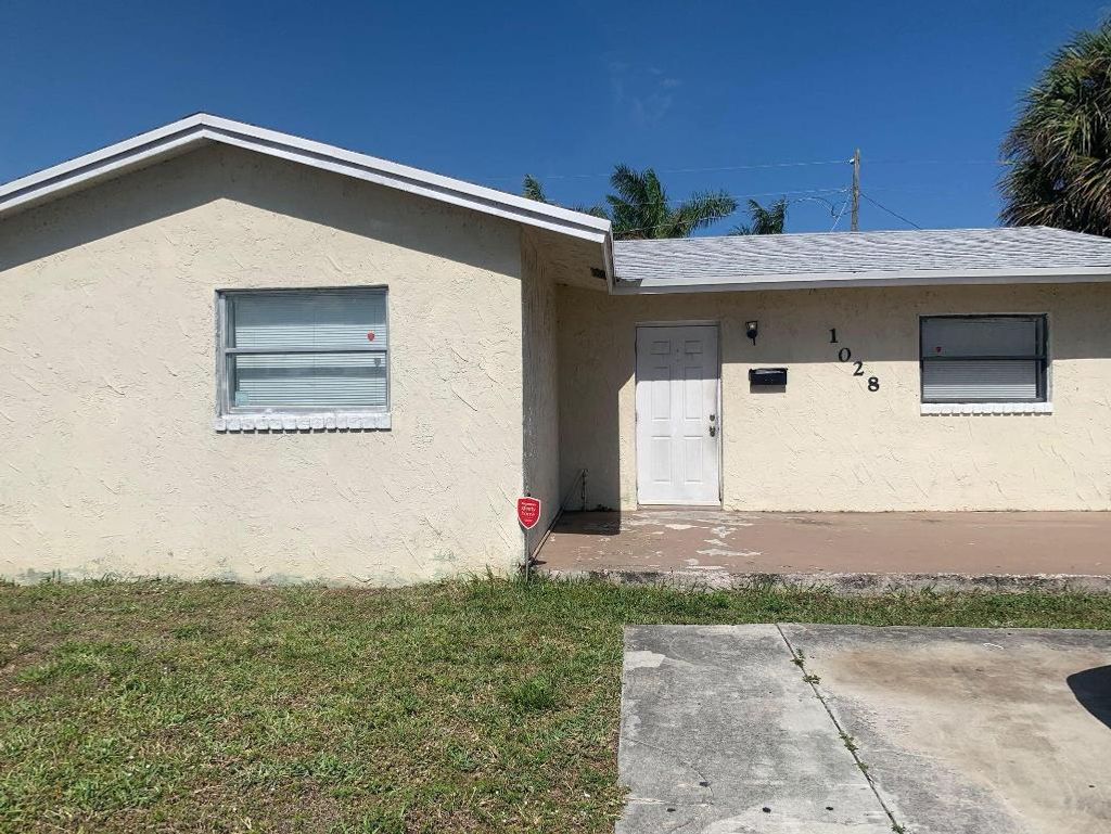 Photo of 1028 W 7th Street, Riviera Beach, FL 33404 (MLS # R11158463)