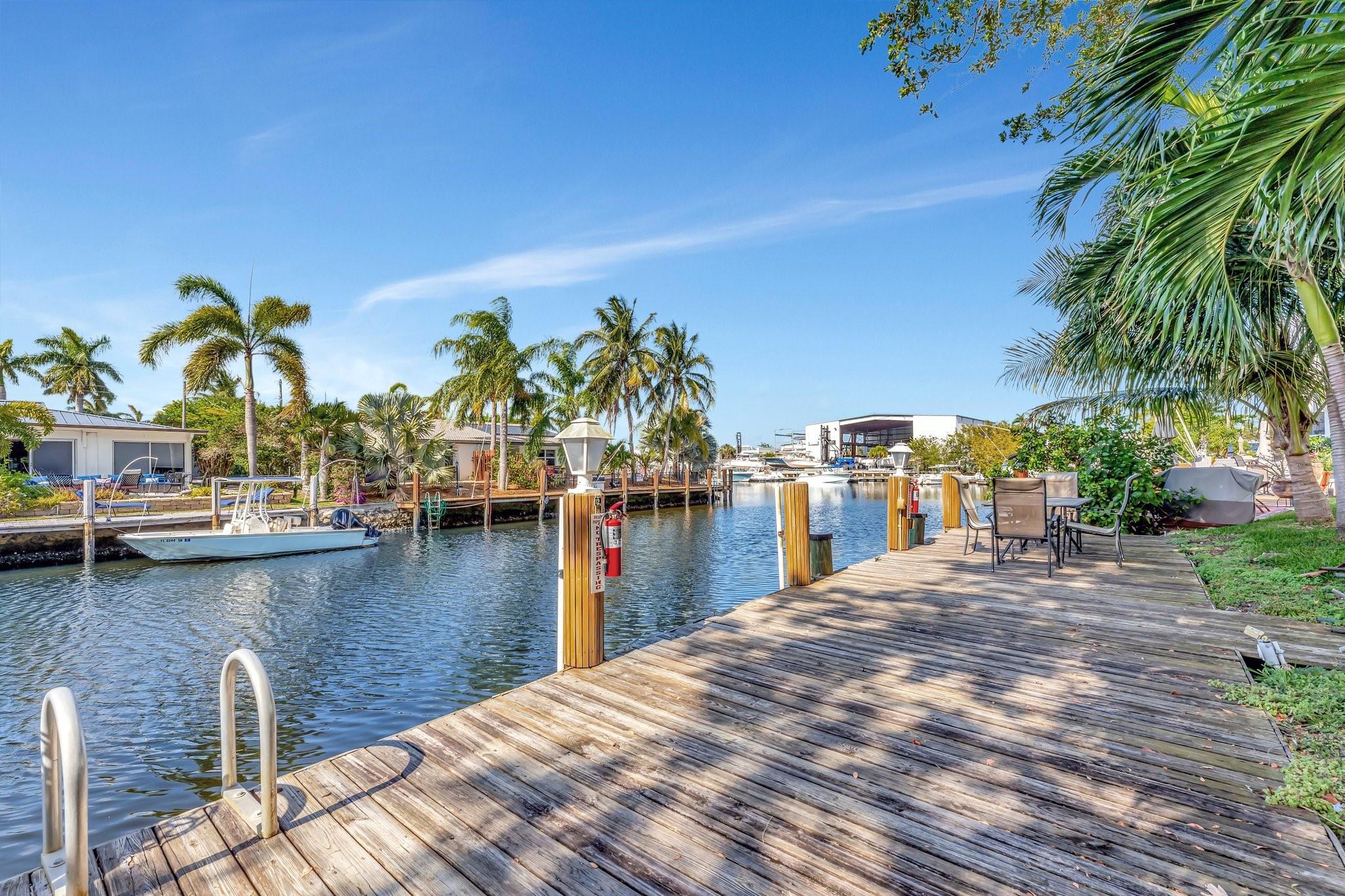 A boater’s dream with a private 60’ dock featuring power and water—perfect for setting up a grill and enjoying
outdoor living after a day on the ocean! This beautifully renovated corner unit offers a modern kitchen with quartz
countertops, new cabinets, stainless steel appliances, and wood-look ceramic tile flooring throughout. Additional
upgrades include a new electric panel, tankless water heater, and a brand-new AC handler and condenser (2025).
Relax on your north-facing balcony any time of the day and enjoy stunning views of the intertwining canals! Amenities include heated pool, spa, sauna, fitness center, putting green, floor to ceiling storage unit and much more! 40 and 50 year inspection passed and all work/assessments have been paid by Seller. All work in condo was permitted!