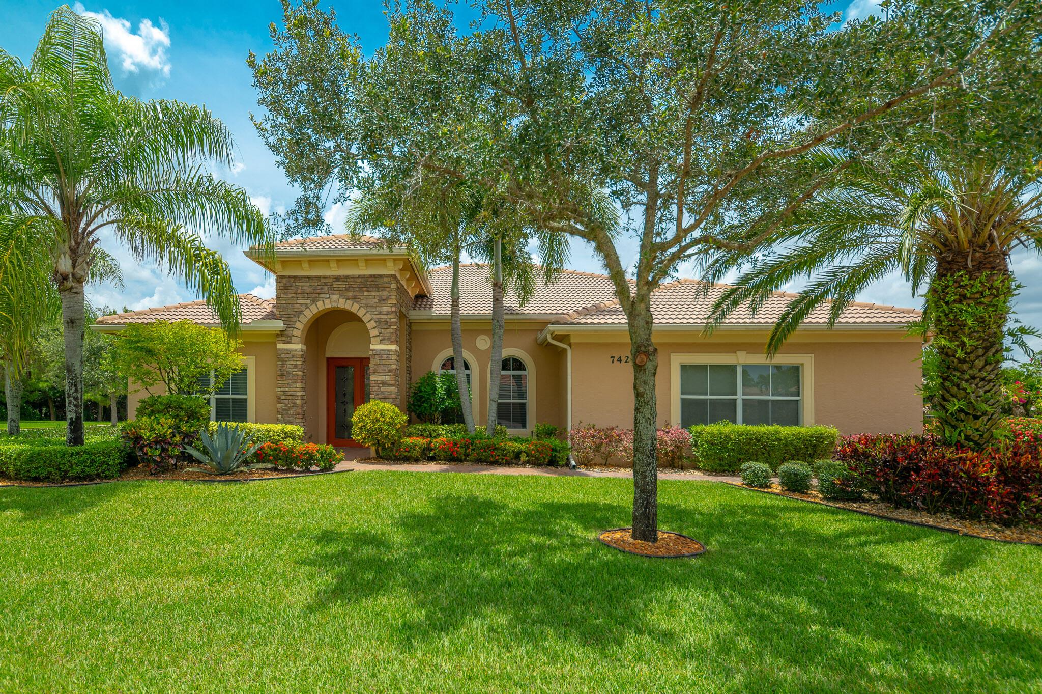 This beautiful Tres Belle home is one of the best values in Martin County! The house is a Kolter-Homes Avalon model with 2541 square feet of living area featuring a great room concept with a and split-plan that has three bedrooms and two baths. The very large great room easily accommodates your desired layouts for living and dining. When you enter the house, you will immediately see the beautiful coffered ceilings, the custom crown moldings, silhouette window shades and the luxury vinyl flooring throughout the house. The master wing is large with two walk-in closets separating the bedroom from the bath. The master bath is very accommodating with his/her's vanities, shower stall, walk-in tub and private water closet. The private guest wing is on the opposite side of the house with a