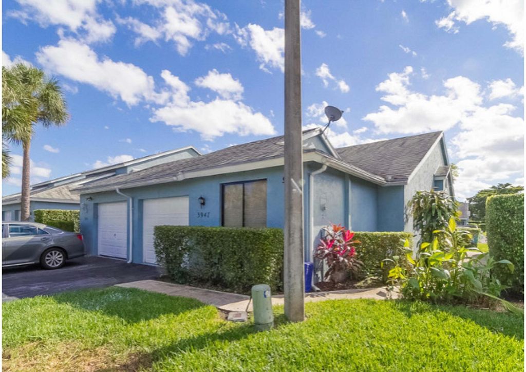 Photo of 3947 Island Club Circle Cir W, Lake Worth Beach, FL 33462 (MLS # R10787477)