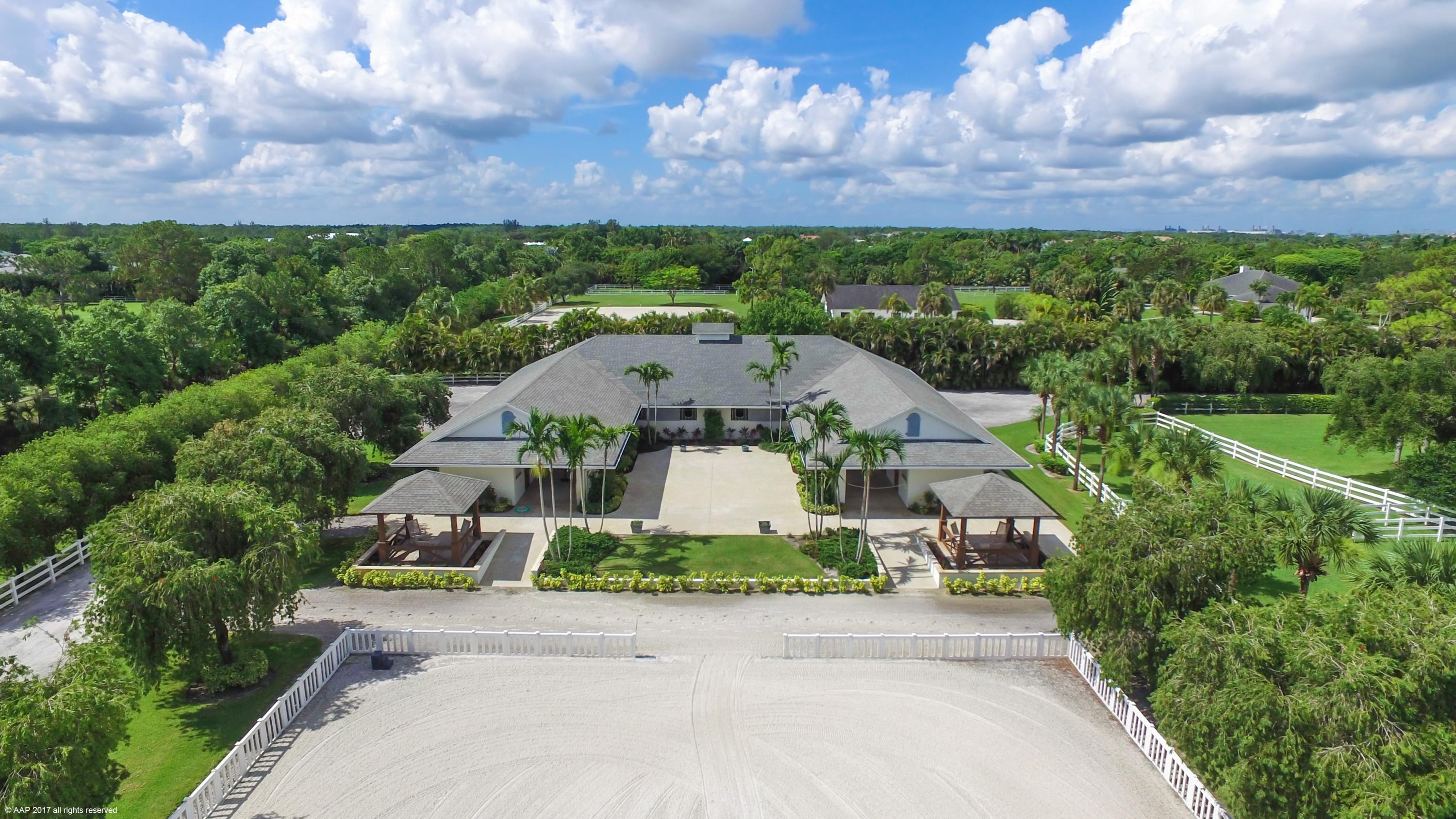 Amazing equestrian property with every amenity the serious rider or trainer could want! Beautifully updated 3-4 bedroom main residence with a private & beautifully landscaped pool & patio area. 12 Stall courtyard style barn, with grooms apartment, feed tack & laundry rooms plus wash stalls. Oversized riding arena with mirrors, 3 acre grass riding field, 8 large grass paddocks, hot walker and round pen. There is a 1BR/1Bth guest house with 1 car garage. The property also has 3 electric gated entries and is situated on a private no-through street. Plenty of room flexible to expand or build a covered arena. The possibilities are endless here!