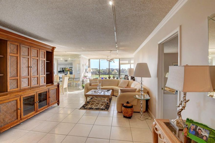 VIEWS VIEWS VIEWS!! Check out this Lakewood Condo with spectacular lake and golf views! Both patios have been extended out to provide a spacious open concept living space. This apartment comes with 2 Covered parking spots!! Experience the #1 Country Club with an amazing condo to match. Mandatory Social Membership and Annual dues.