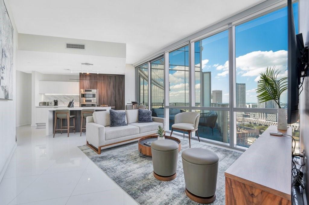 Beautiful 1 Bed+Den+1.5 full Baths LUXURY UNIT at the most coveted building in Downtown, Paramount Miami World Center. PRIVATE Elevator to Unit, 10-foot ceilings, White ceramic floors throughout, Designer European kitchens, built-out closets and in-unit laundry room. Floor-to-ceiling windows and oversized balcony overlooking beautiful city views. Blinds on all windows, 2 Car spots (1 Valet & 1 Assigned spot). HOA fee includes Internet, Cable and Water. Enjoy world-class amenities like Basketball Court, 5 pools, Spa, Gym with boxing area, BBQ Kitchen, Virtual Golf, Recording Studio, Racquetball, Yoga Studio, Sunrise pool, & Kids Play Area, Soccer field, Sky deck.