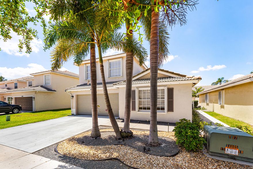 Welcome to this beautifully upgraded 2-story, 4-bedroom home offering the perfect blend of modern comfort and serene lakefront living in Lake Worth. Step inside to discover a bright, open layout with large-format 36x36 porcelain tile throughout the main living areas, complemented by water-resistant laminate flooring in the bedrooms—designed for both style and durability. The chef-inspired kitchen is the heart of the home, featuring luxurious quartzite countertops, custom cabinetry, and premium GE Profile appliances—perfect for everyday living and entertaining. Enjoy the flexibility of multiple bedrooms on the main level, ideal for guests, a home office, or multigenerational living. Unwind in your private primary suite featuring a spa-like bathroom with a jetted soaking tub, creating the  perfect retreat after a long day. Step outside to your fenced backyard with low-maintenance synthetic grass and take in peaceful lake views—your own private escape. Additional highlights include: * Smart home features with WiFi-enabled lighting & irrigation * Epoxy-coated garage floor * Full accordion hurricane shutters for peace of mind * HOA includes cable, internet, and lawn care for added convenience  Prime Lake Worth location with easy access to shopping, dining, and major roadways.  Motivated seller - priced for immediate interest. Schedule your showing today before it's g