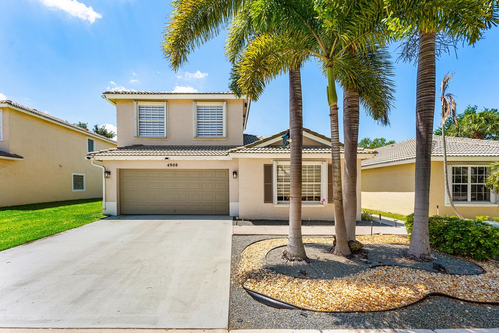 Photo of 4908 Lombard Pass Drive, Lake Worth, FL 33463 (MLS # B26025045)