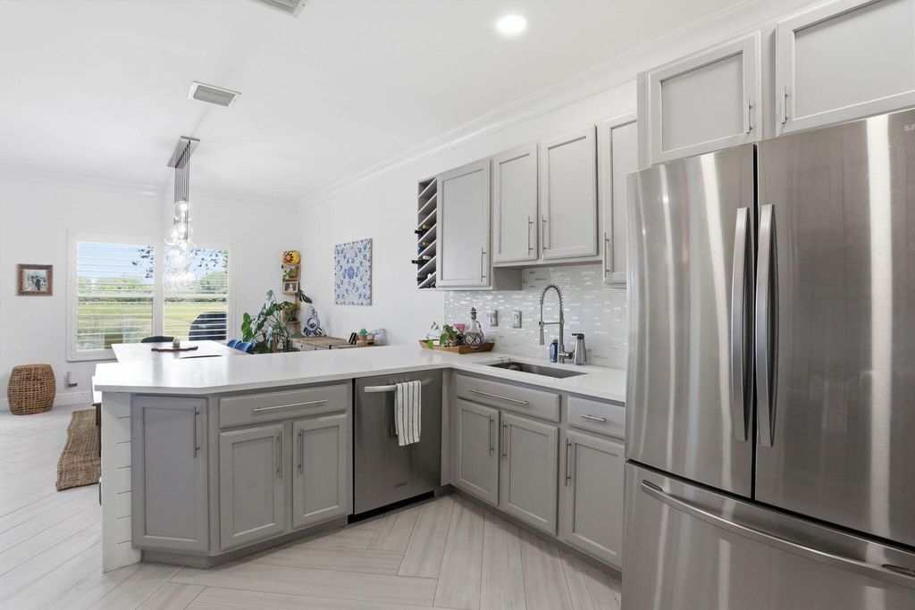 Photo of 4103 Bamboo Palm Court, Greenacres, FL 33463 (MLS # B26022085)